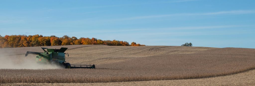 Combine harvesting soybeans for processing into ExPress soymeal.